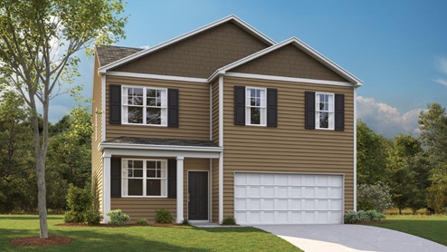 Two story home with two car garage and vinyl siding