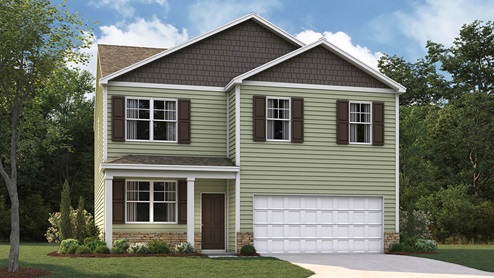 Two story home with two car garage and vinyl siding