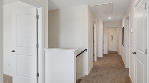 Upstairs hallway with carpet