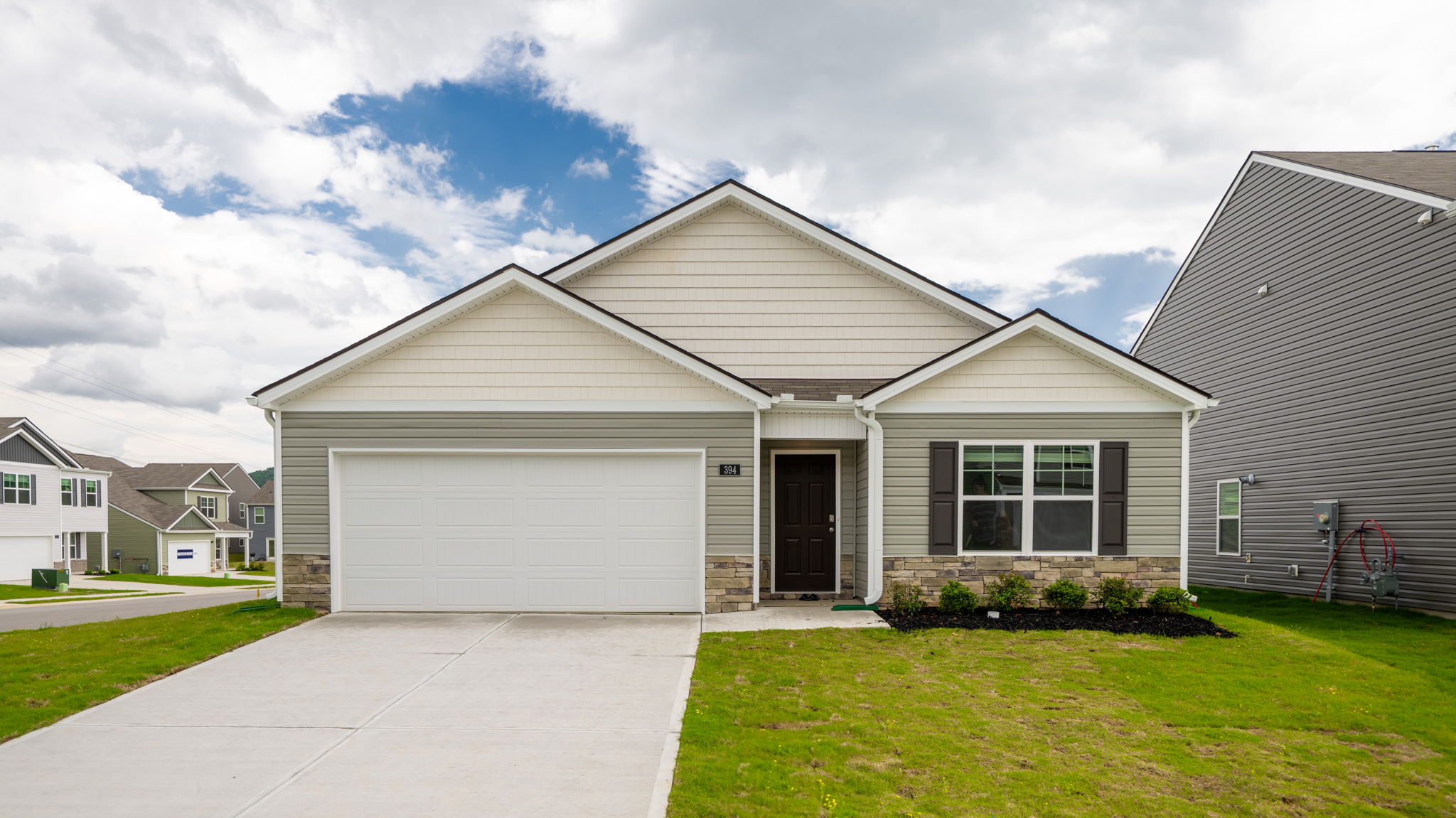 One story home with two car garage and siding