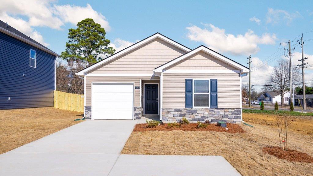 Exterior of one story home with single car garage