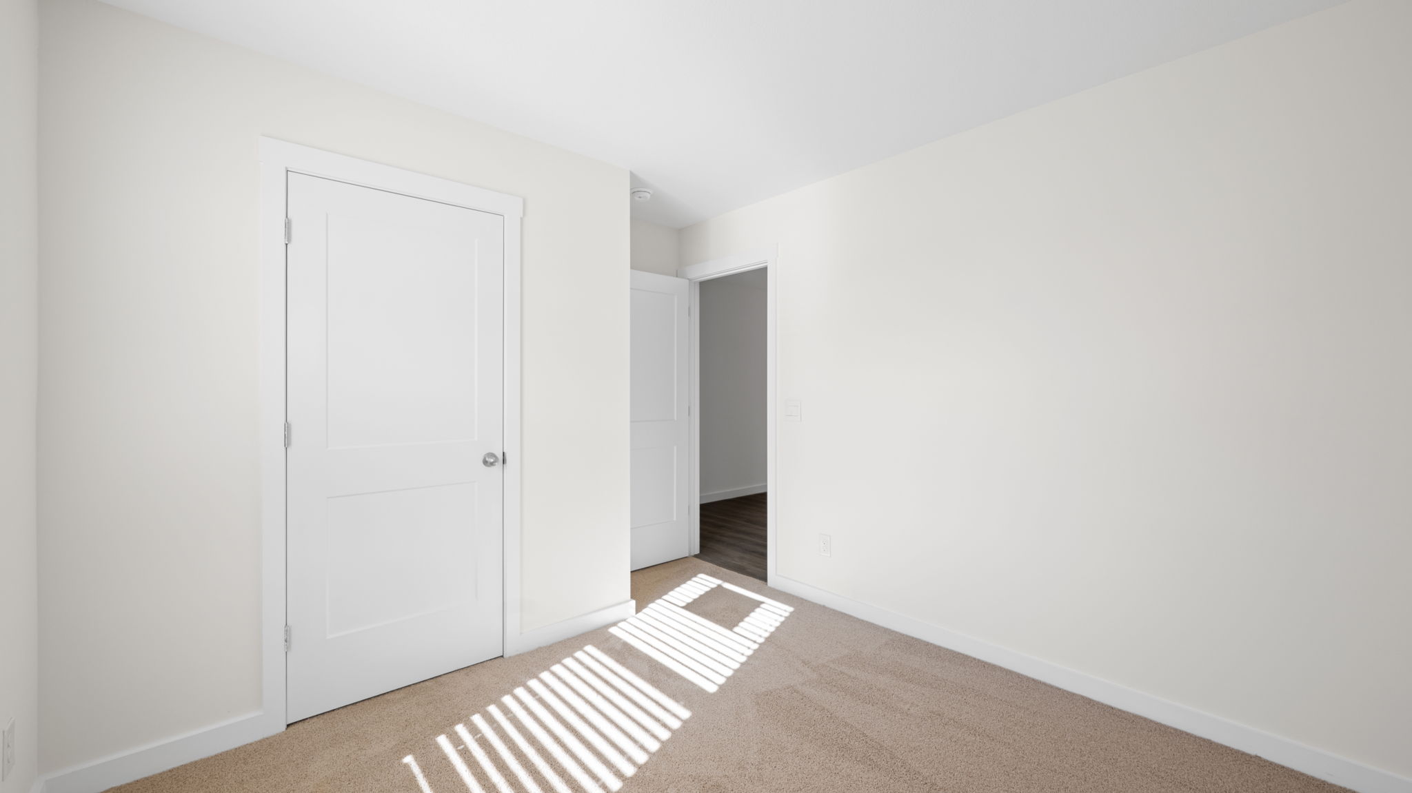 bedroom with single window and walk-in closet