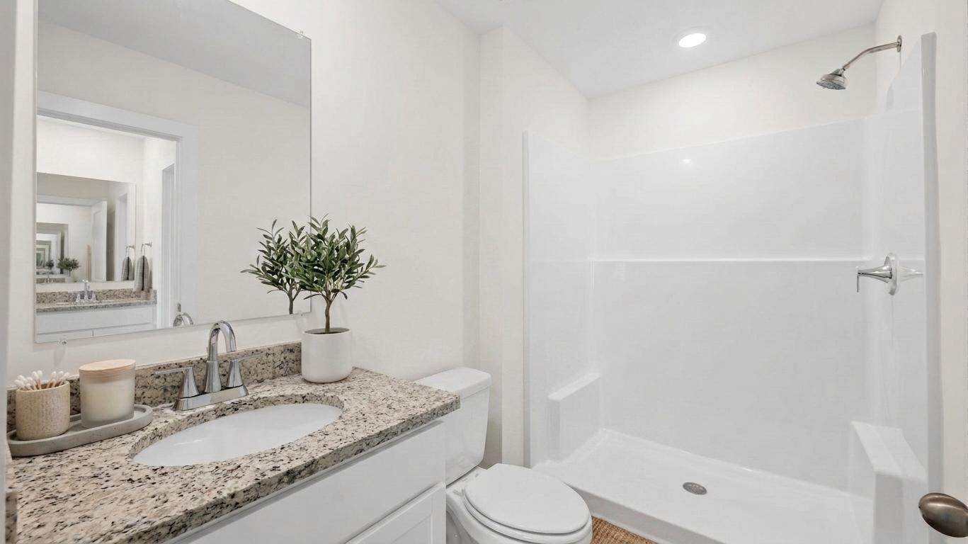 bathroom with decor and shower