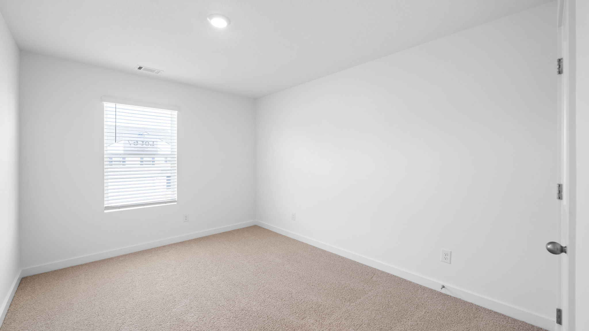 bedroom with single window and walk-in closet