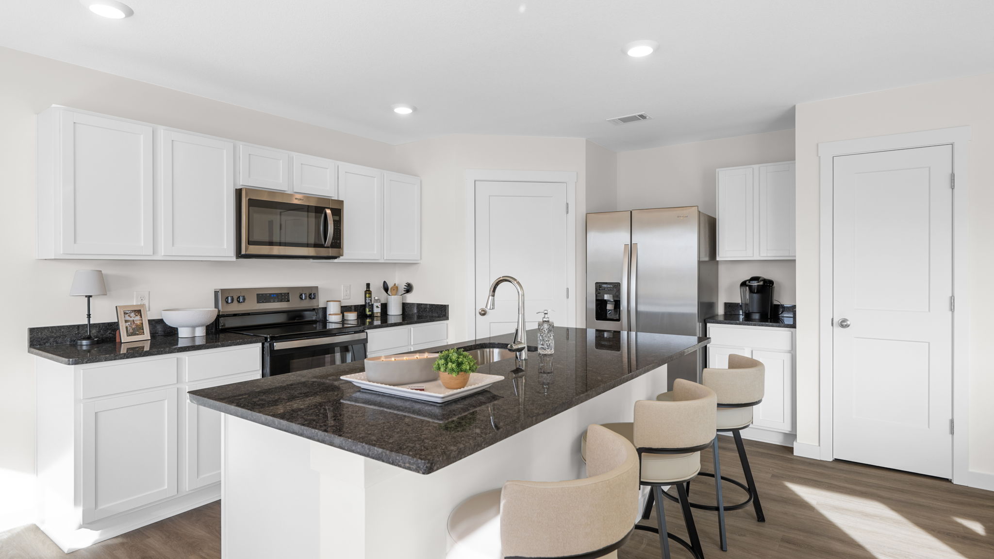 open concept kitchen with large island and stainless steel appliances
