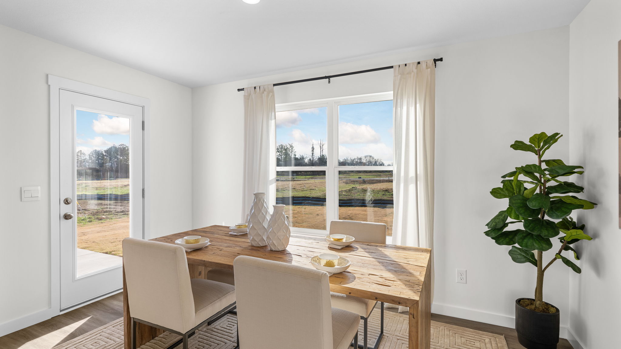 dining area with double window and back door