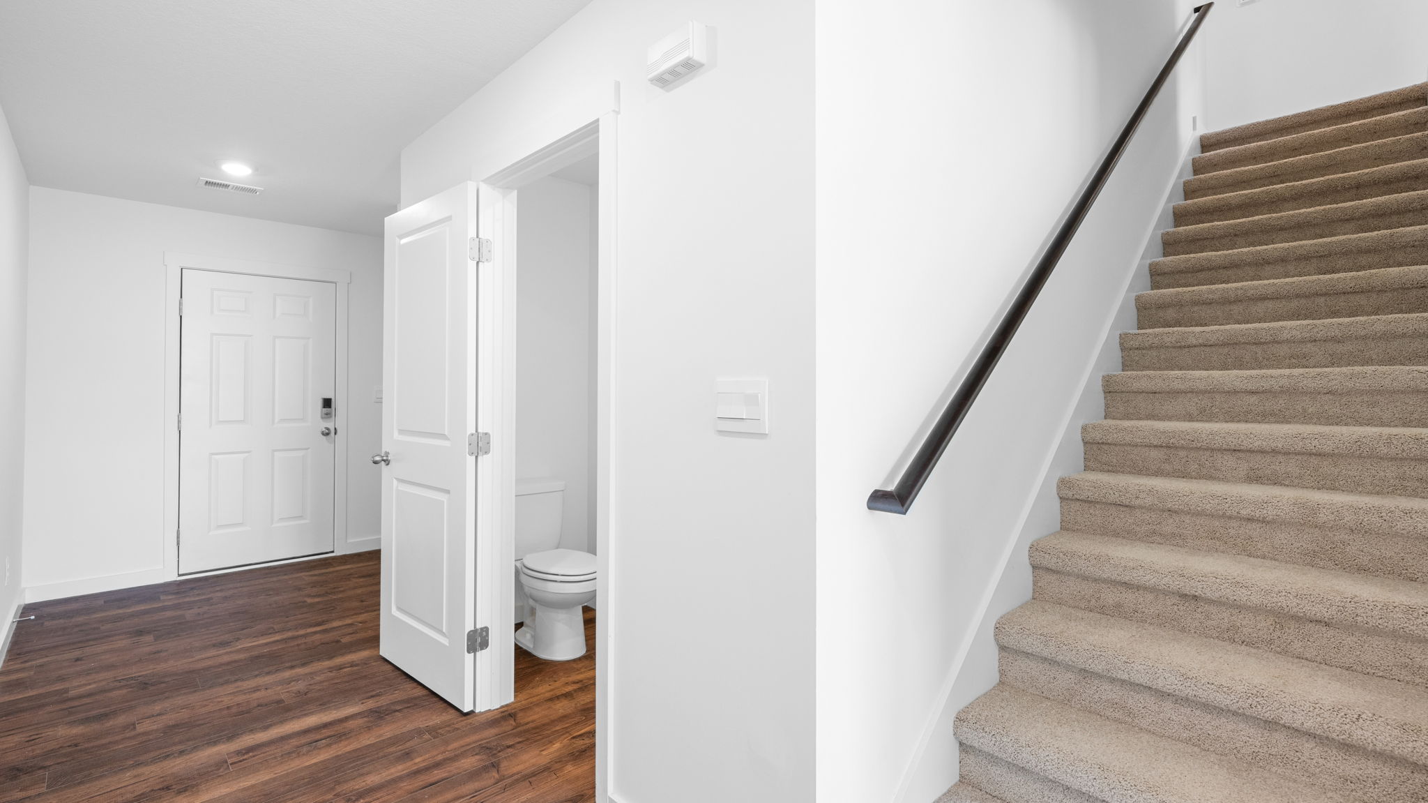 guest bath and stairs leading to the second story