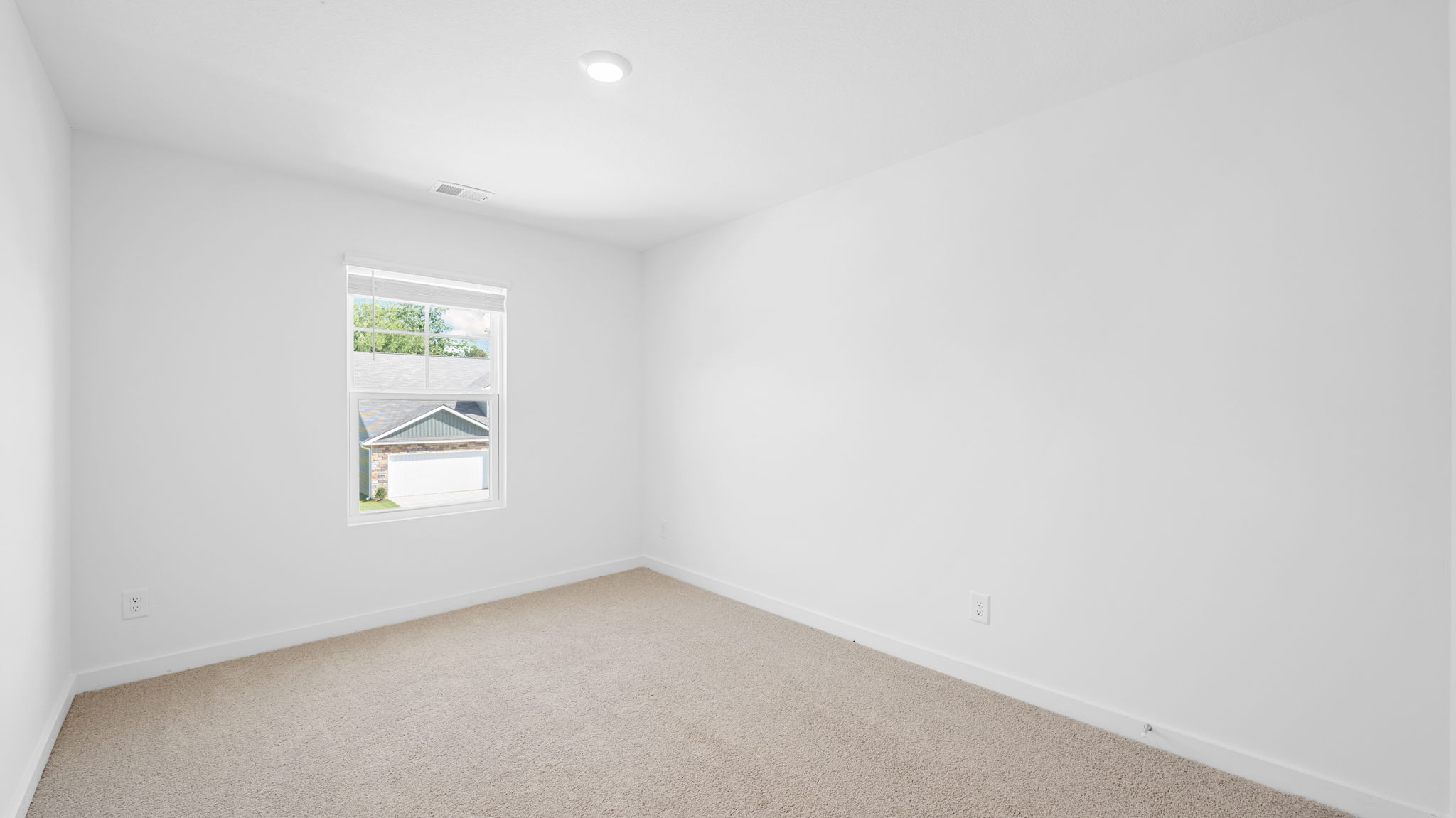 bedroom with carpet and window