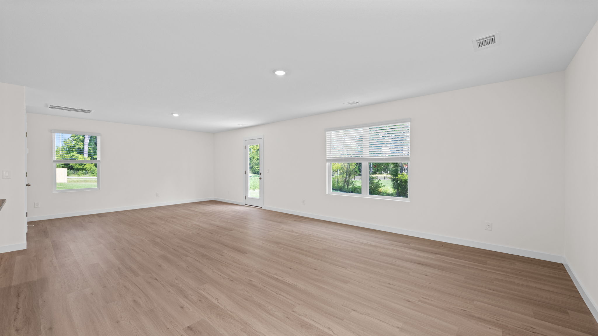 open concept living room with windows