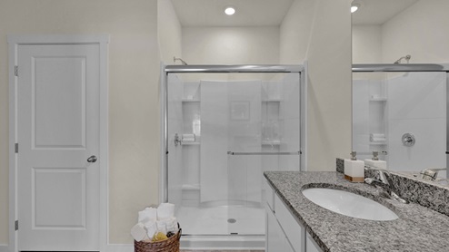 Primary bathroom with glass shower door