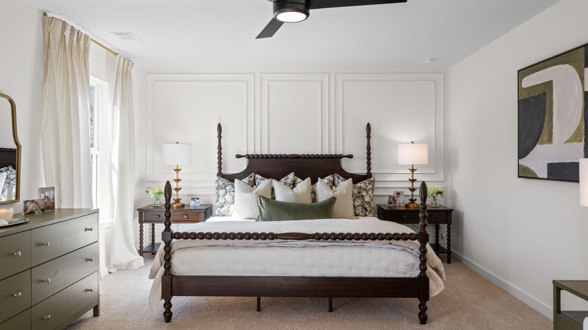 Primary bedroom with trim package and ceiling fan