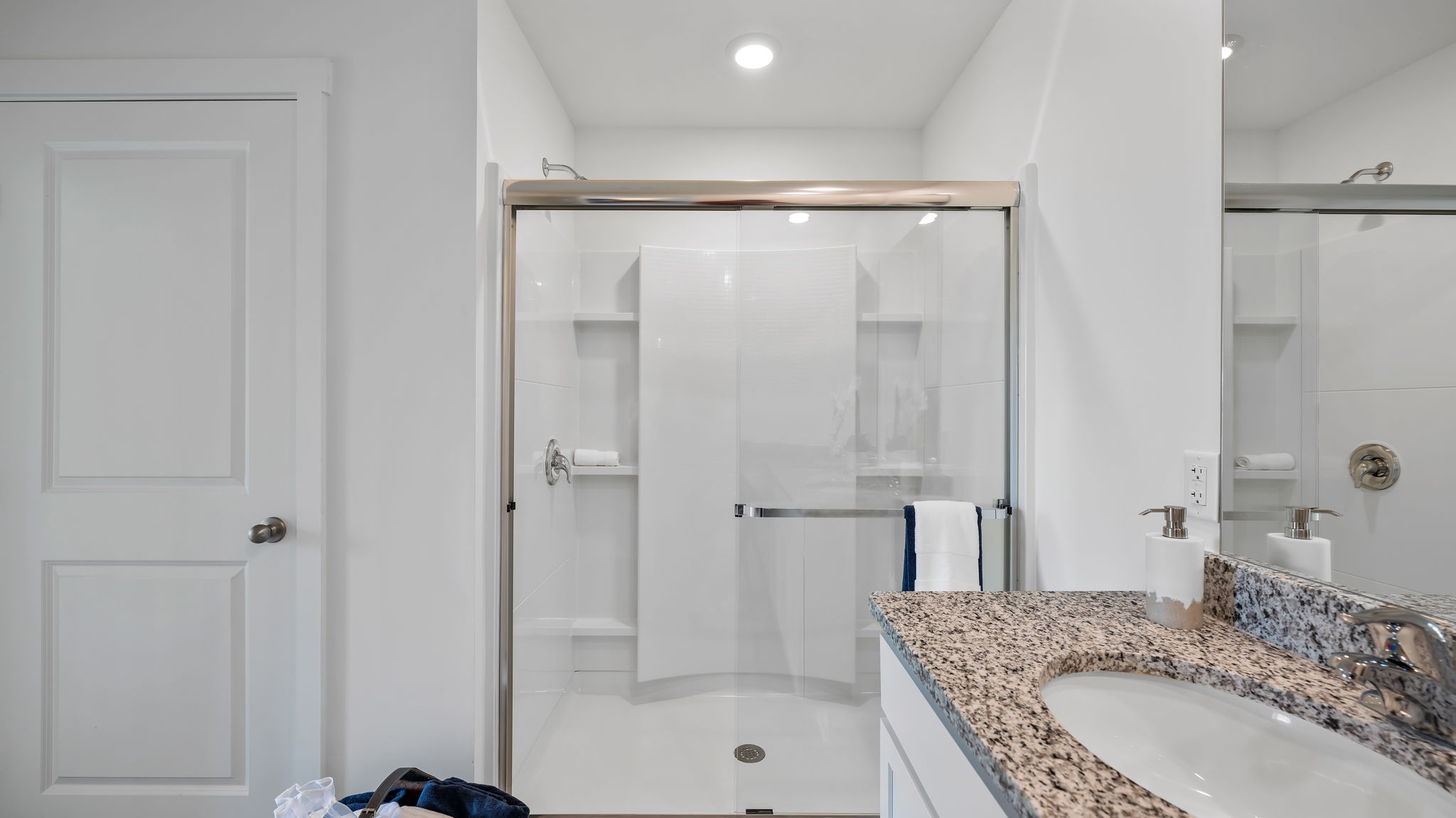Primary bathroom with glass shower door