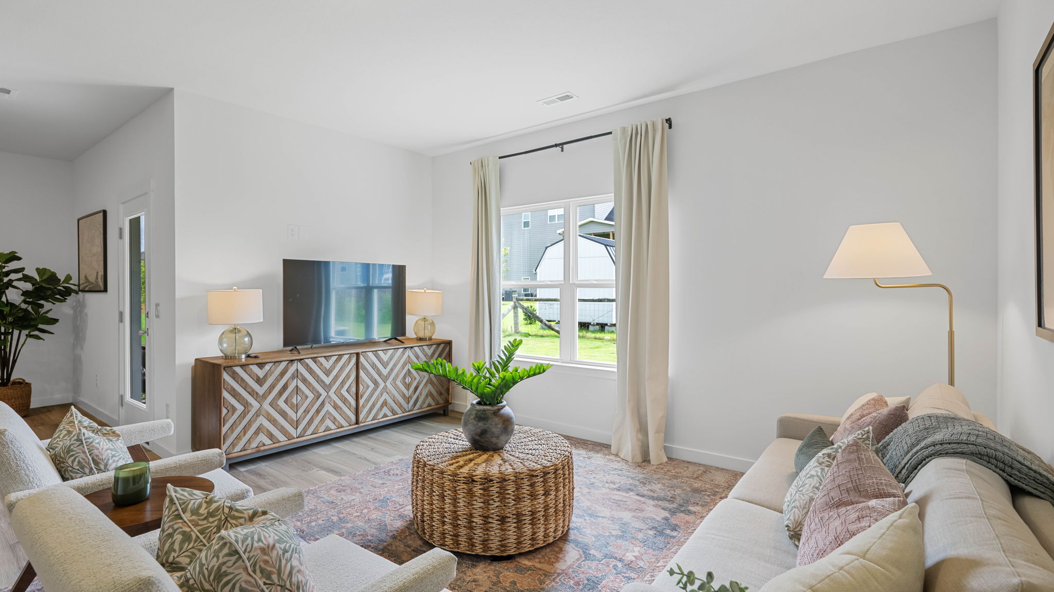 Living room with double window and LVP