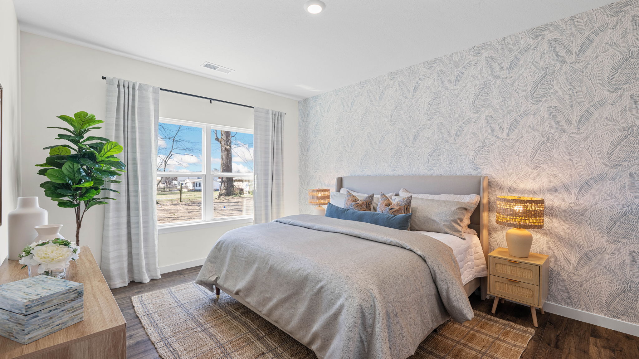 Primary bedroom with large double window