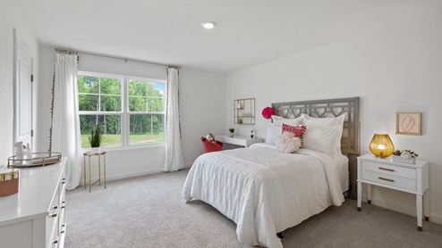 Second floor guest bedroom with double window