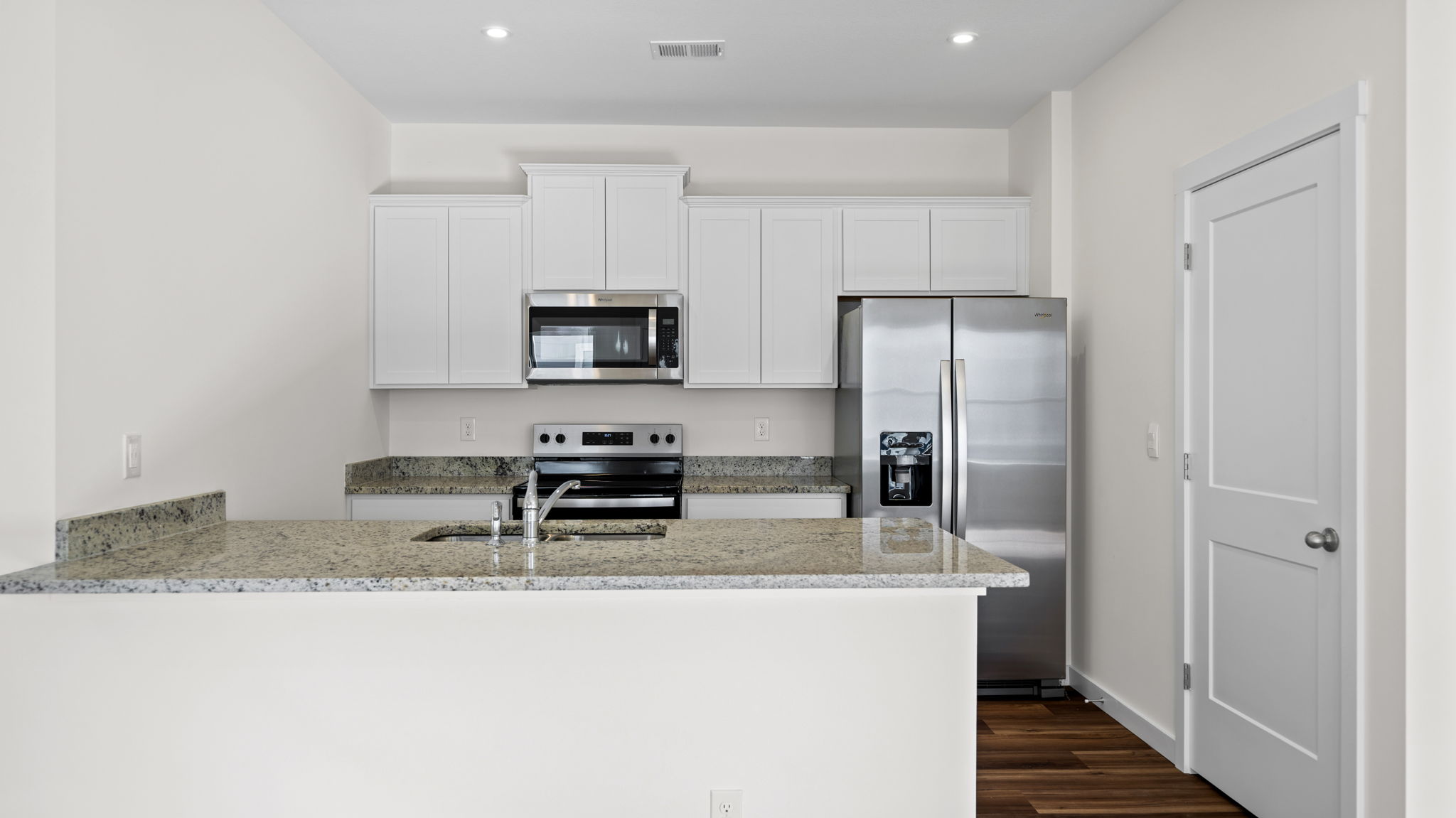 kitchen with island and refrigerator