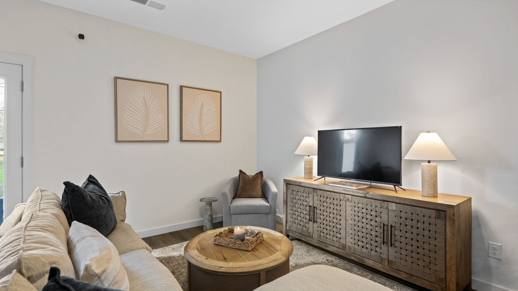 living area with large cabinet and television