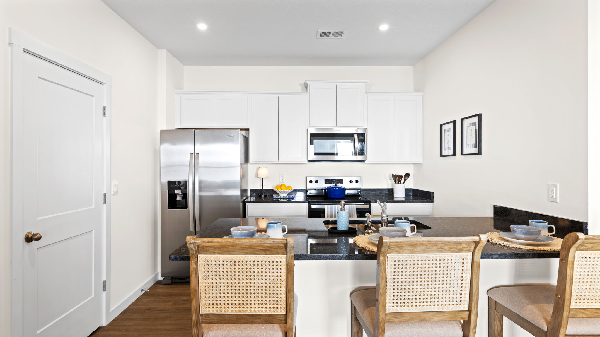 the kitchen island has three stools