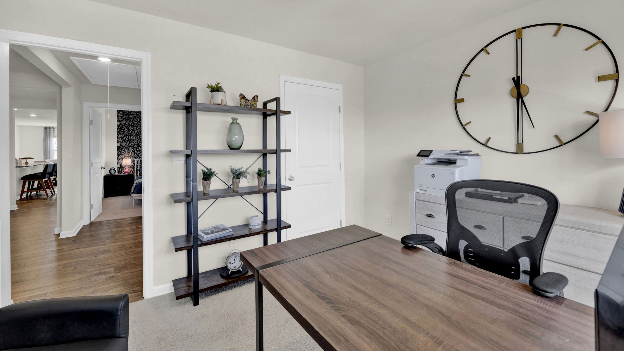 office area with desk and chair and clock