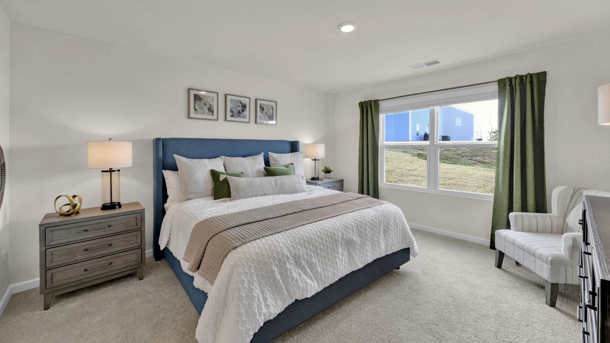 bedroom with carpet and large windows