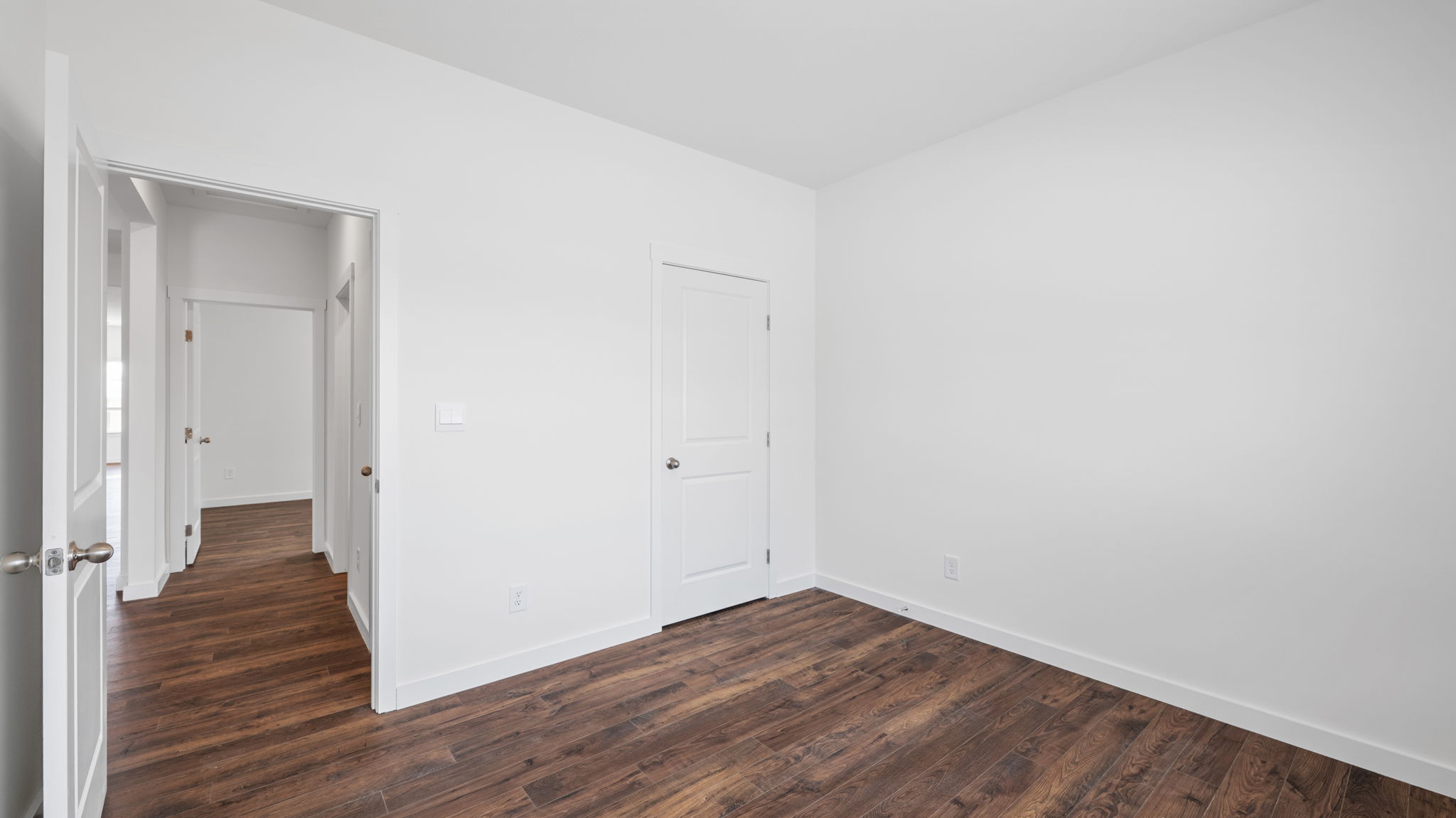 bedroom with door opening into hallway