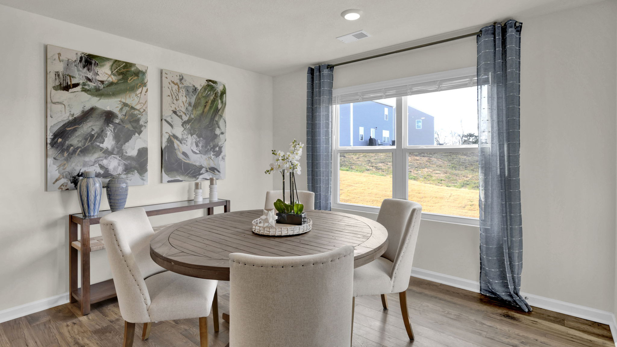 Eating area off kitchen with windows