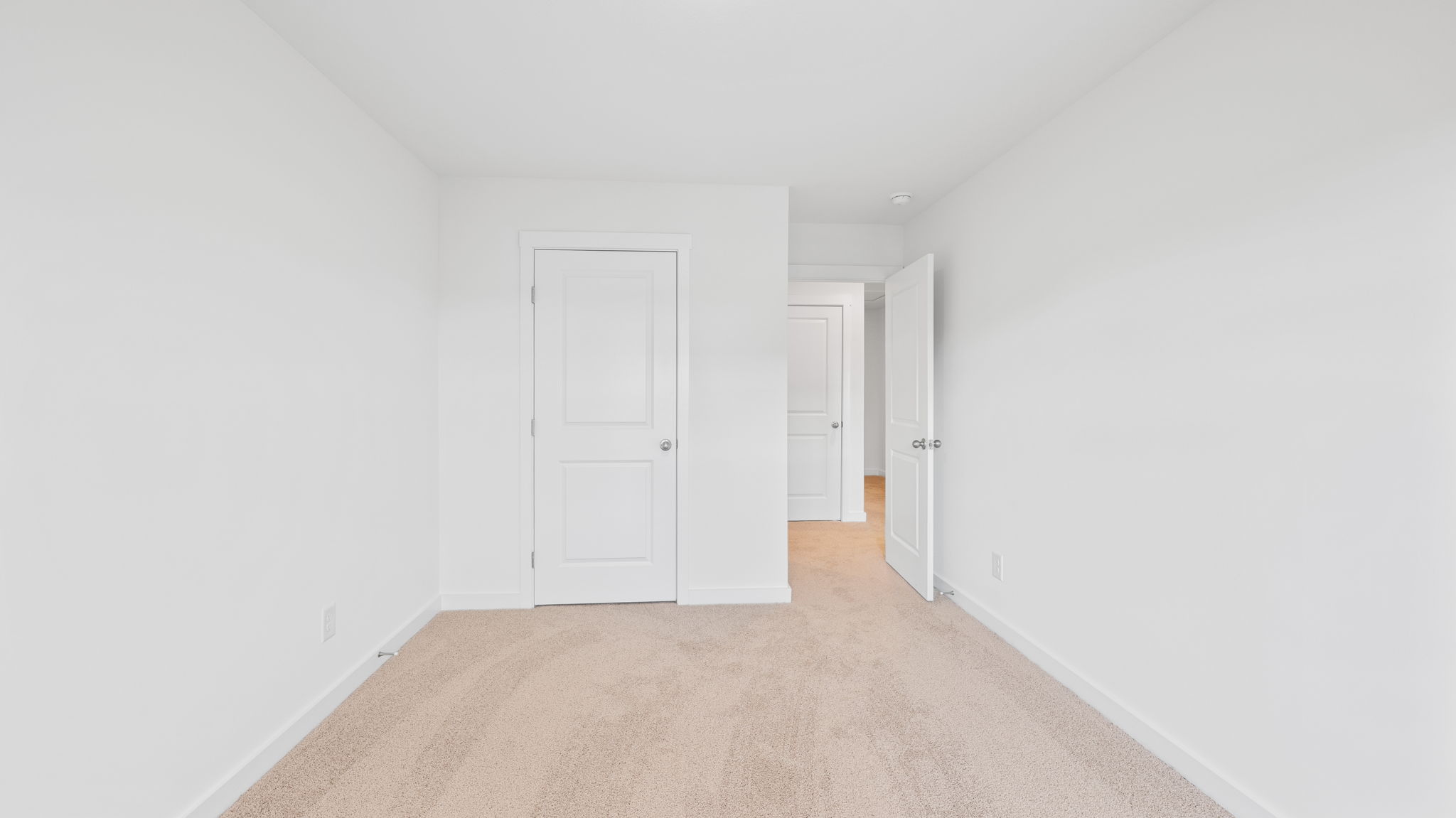 bedroom with carpet and doorway