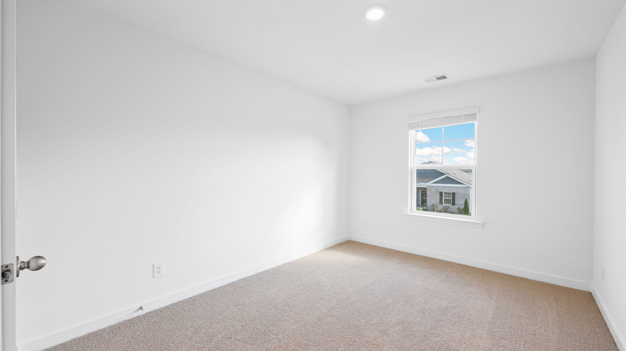 bedroom with carpet and window