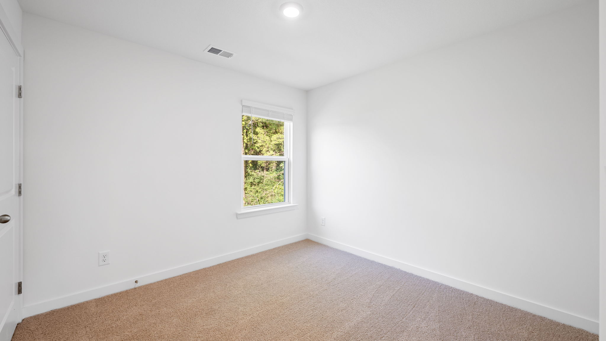 bedroom with carpet and window