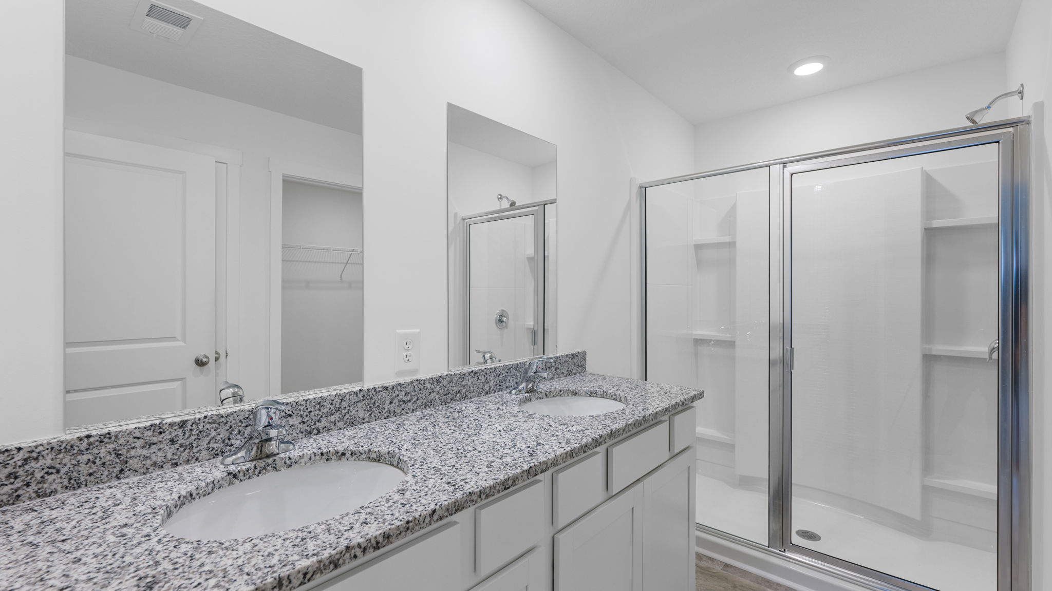 bathroom with vanity and shower