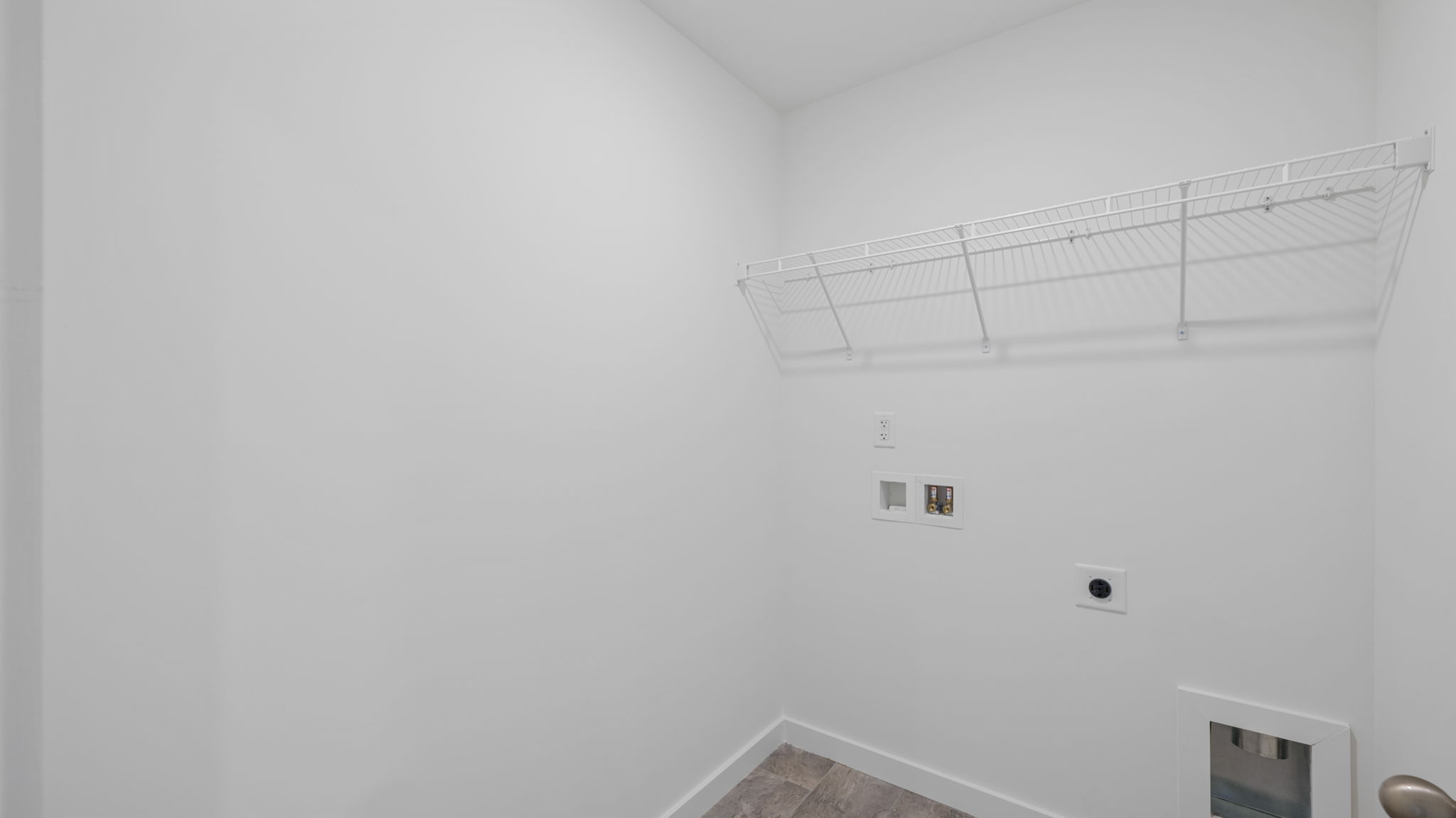 laundry room with shelving