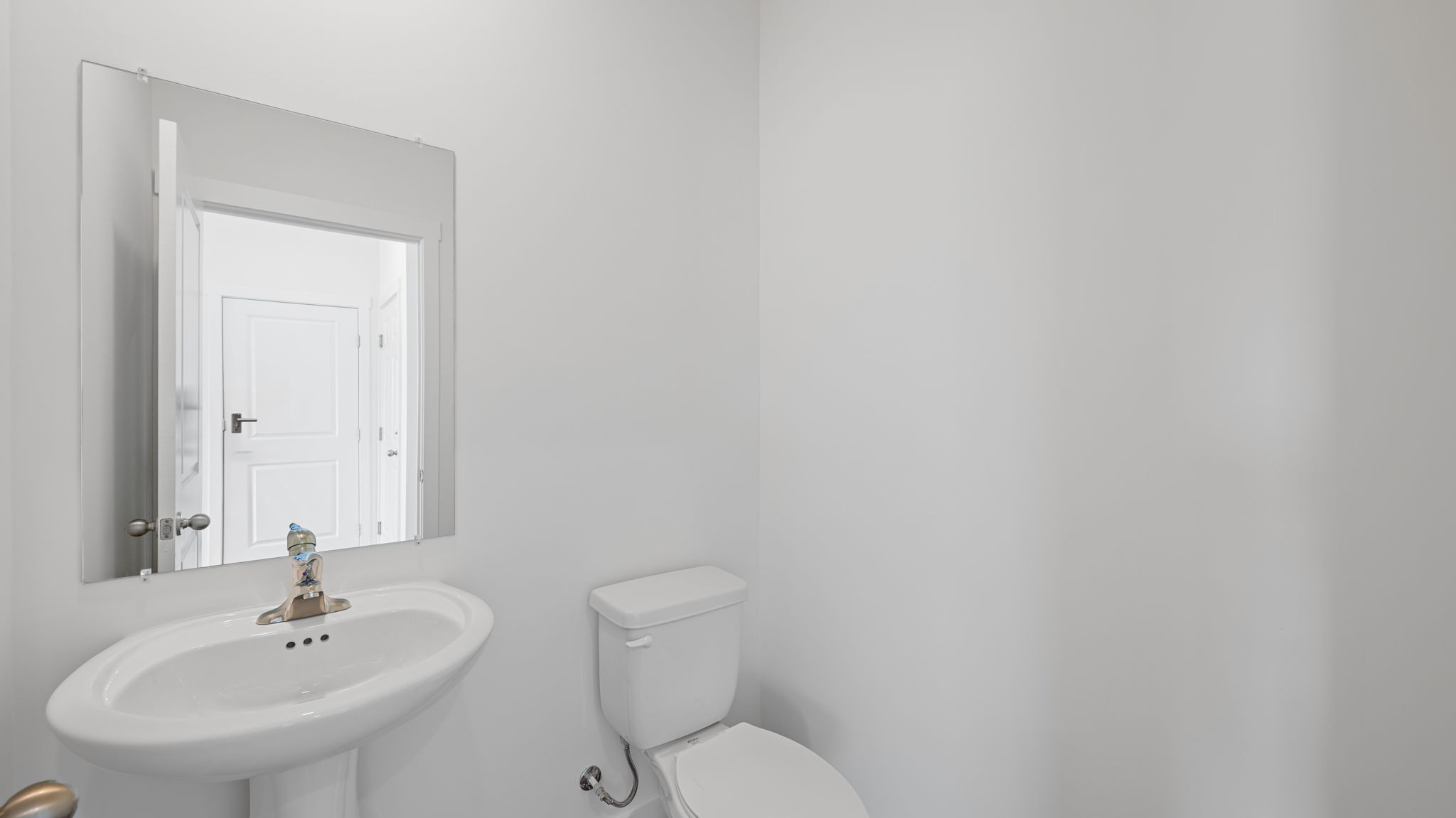 powder room with sink and mirror