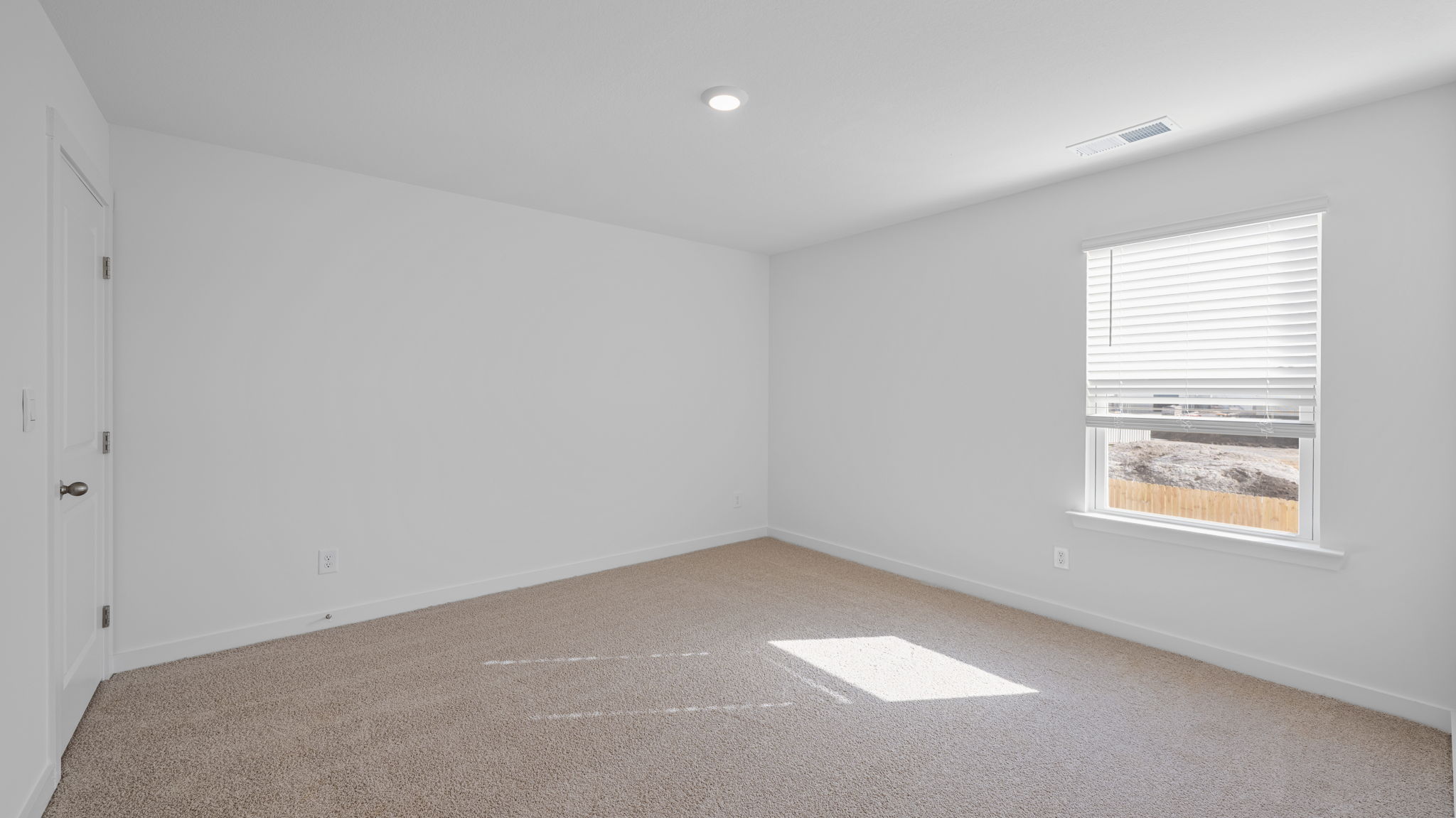 bedroom with carpet and window