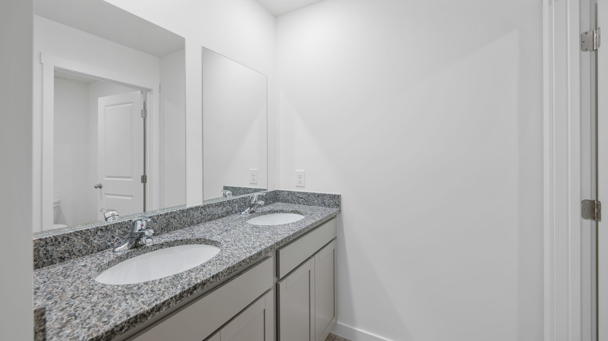 bathroom vanity with cabinets and mirrors