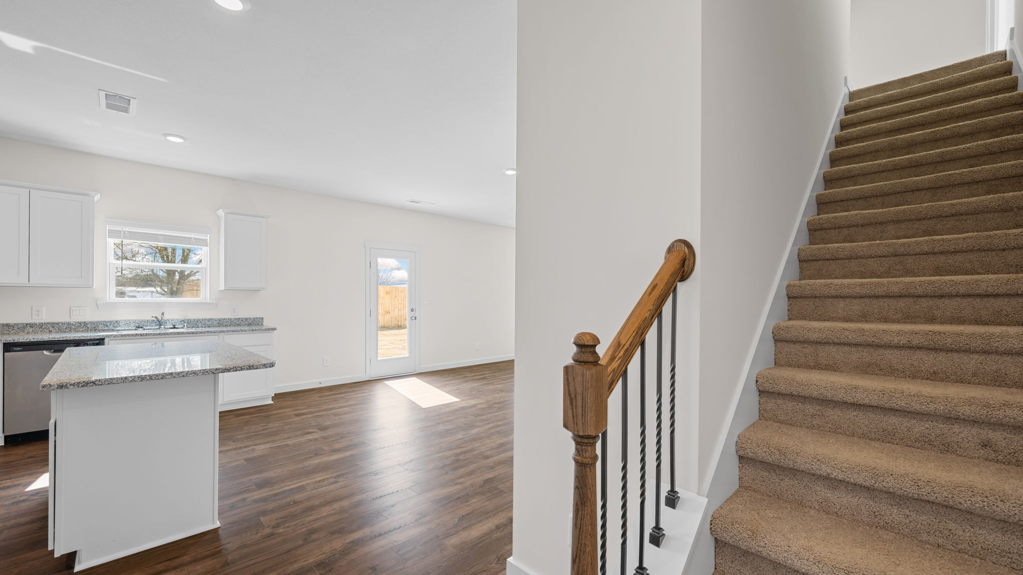 stairwell has carpet and leads to the loft area
