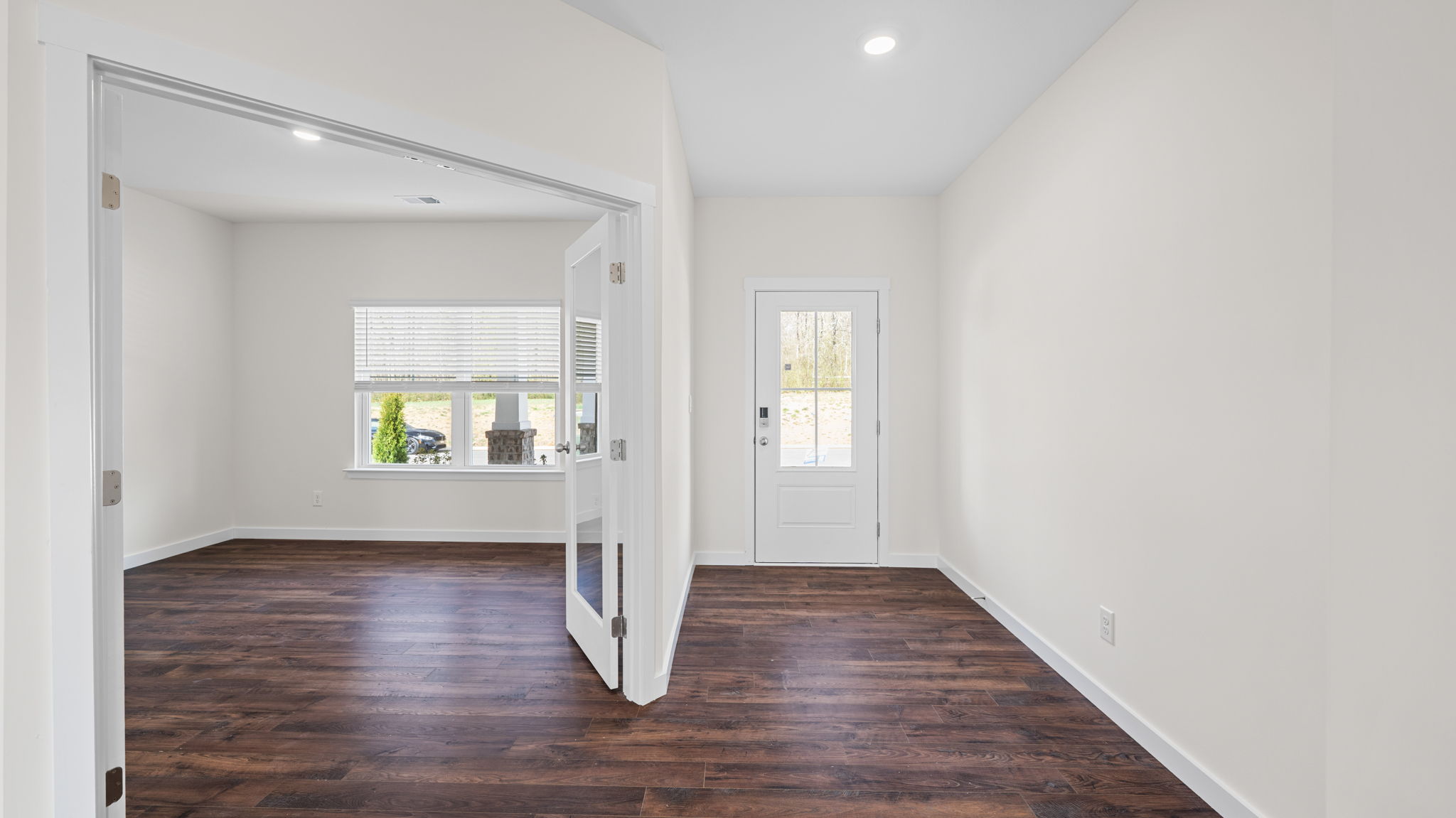 study area with solid flooring and french doors