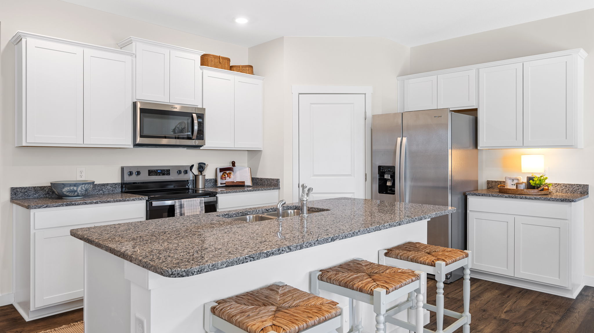 Kitchen area with island and open living area