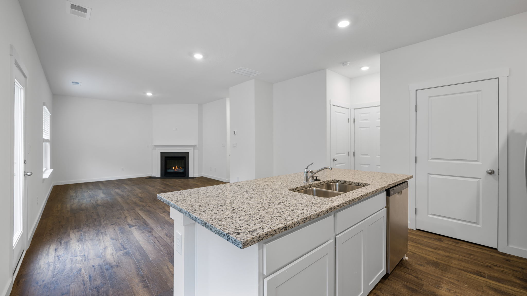 open concept kitchen with stainless steel appliances and large island