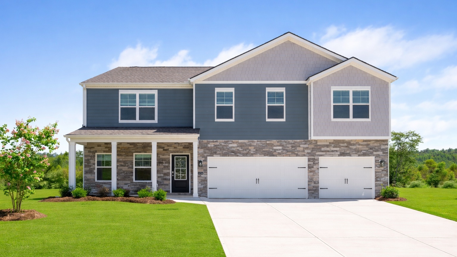 two story home with three car garage with green grass