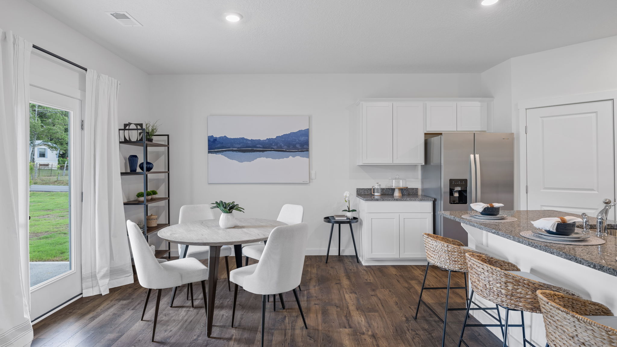 open concept dining room with back patio door