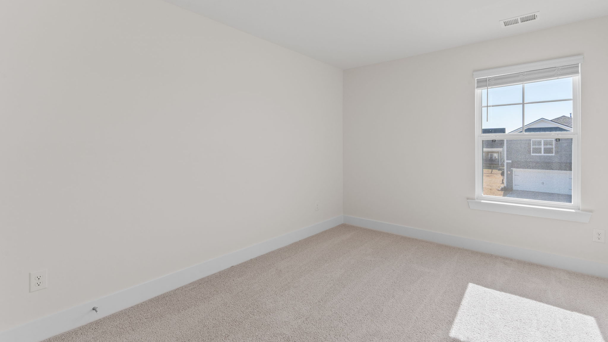 Guest bedroom with carpet