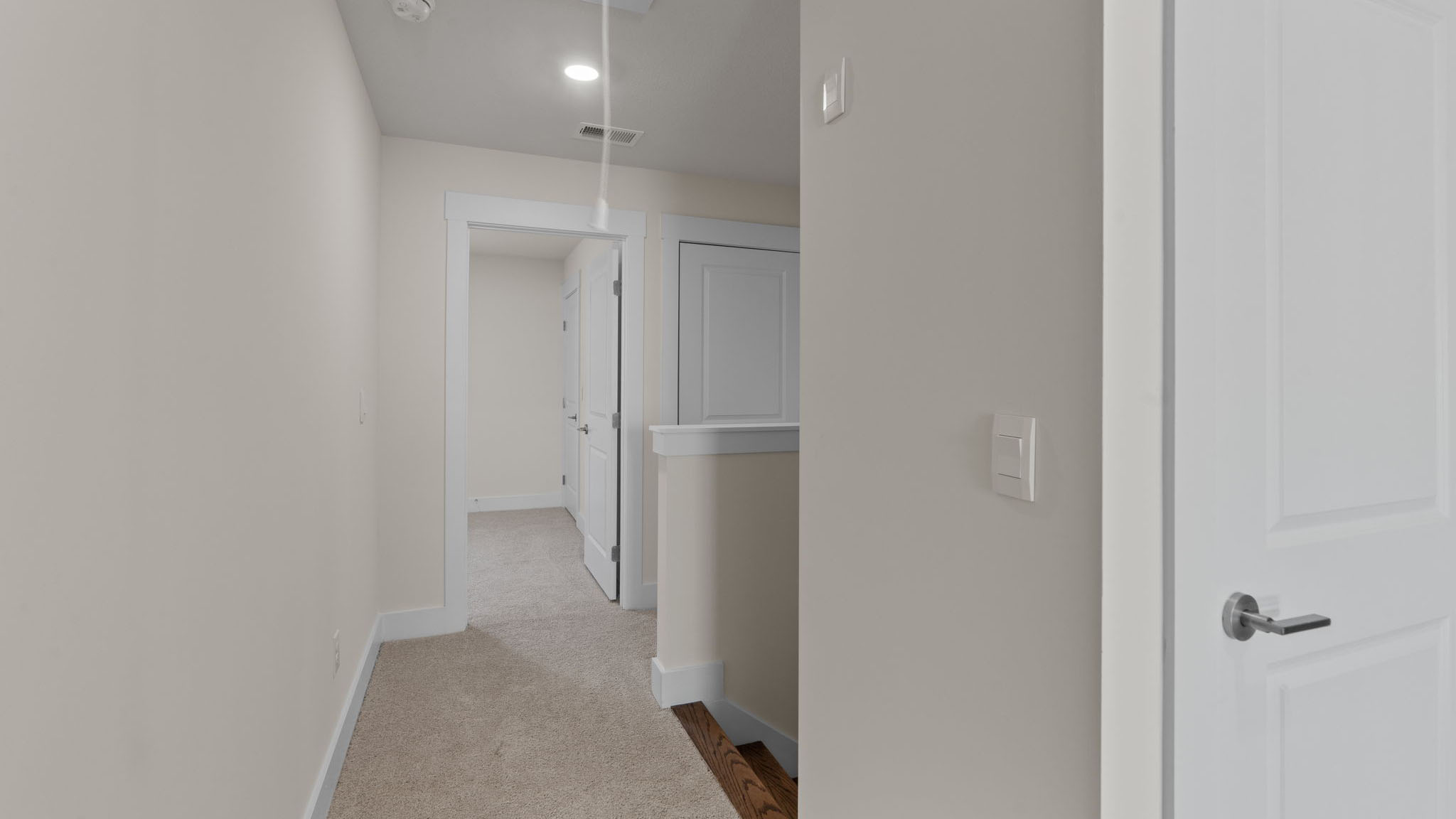 Upstairs hallway with carpet