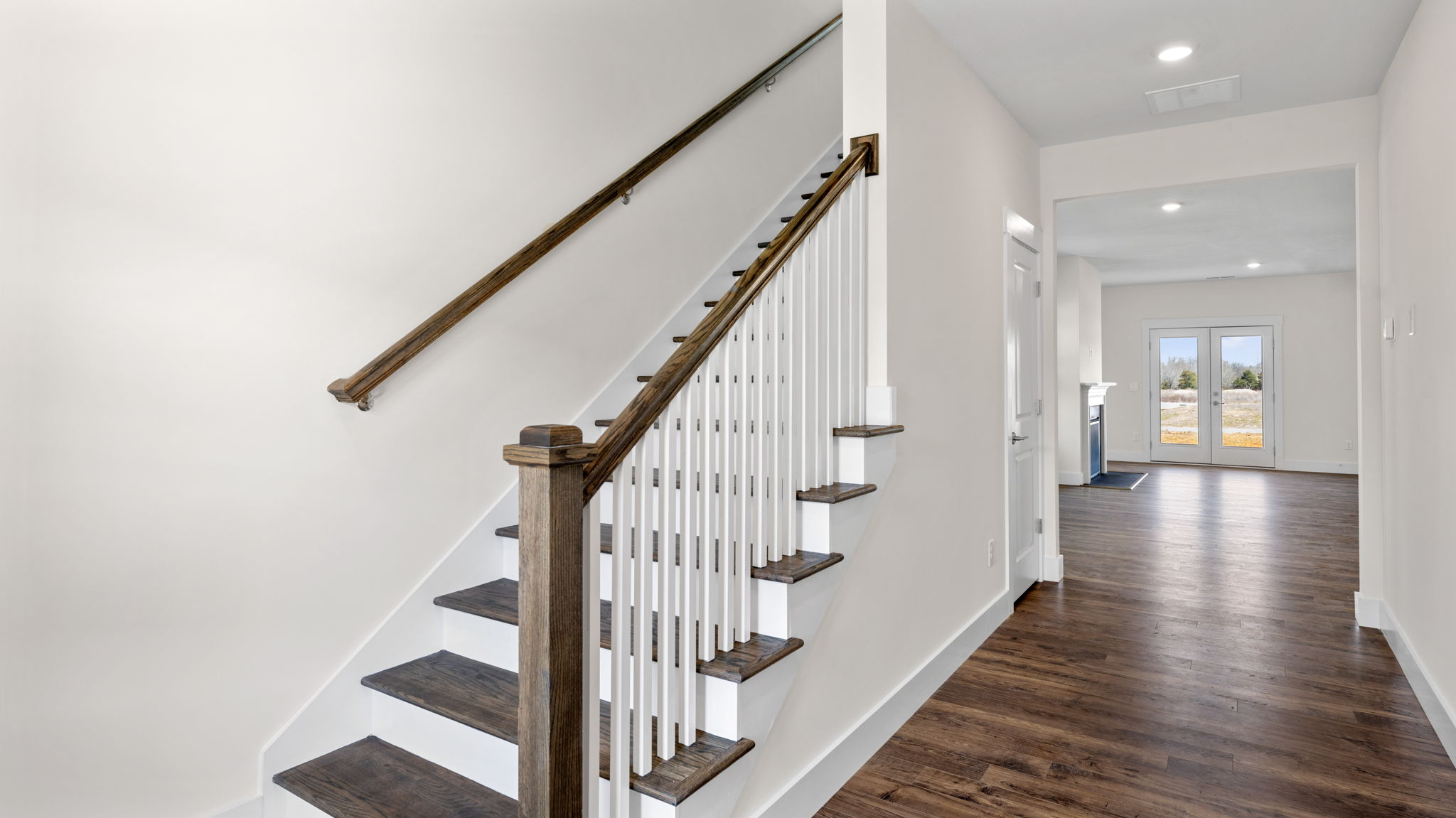 The hallway leads to the stairs that bring you to the second floor.