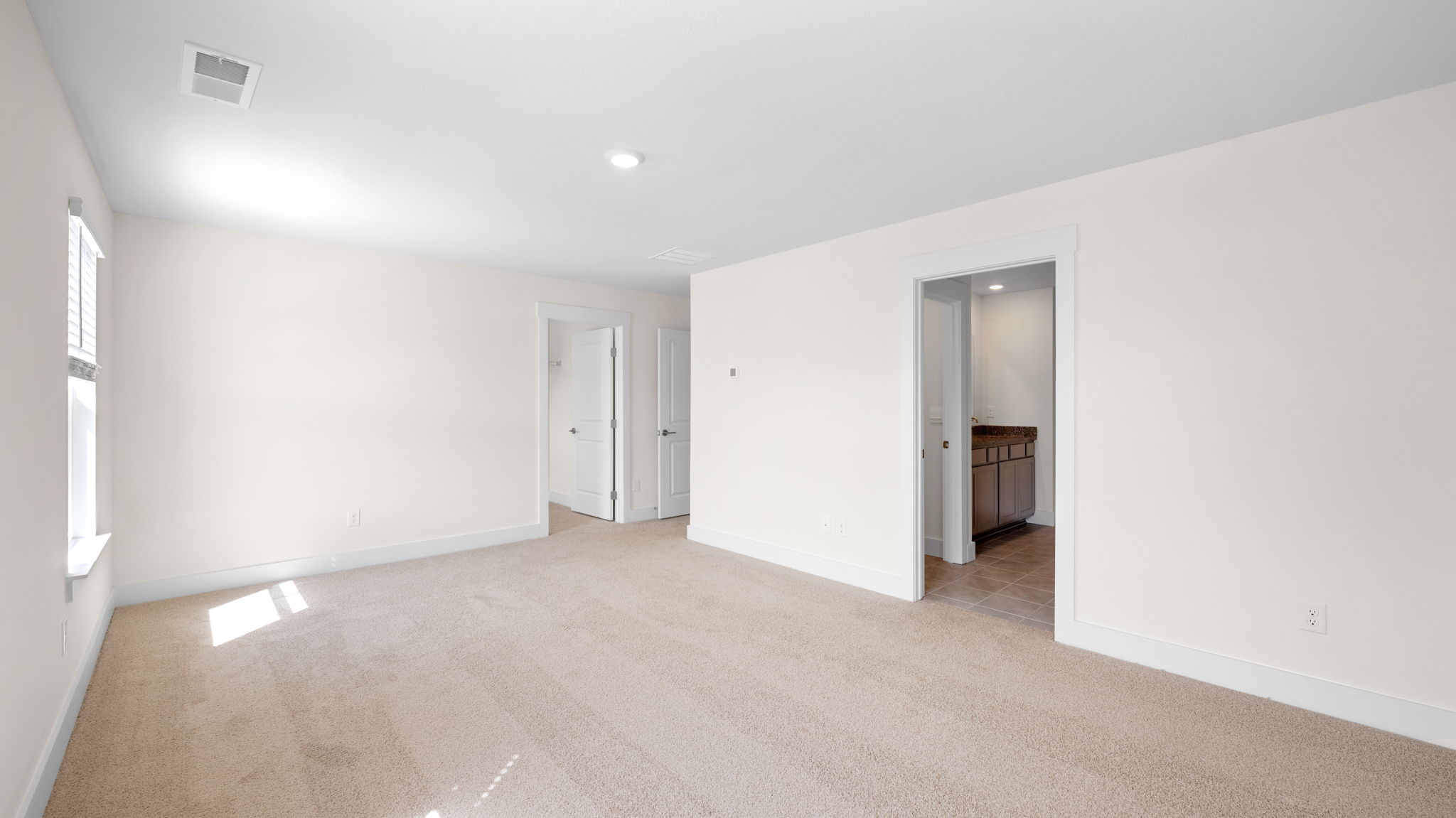 The large bedroom comes with a private bath.