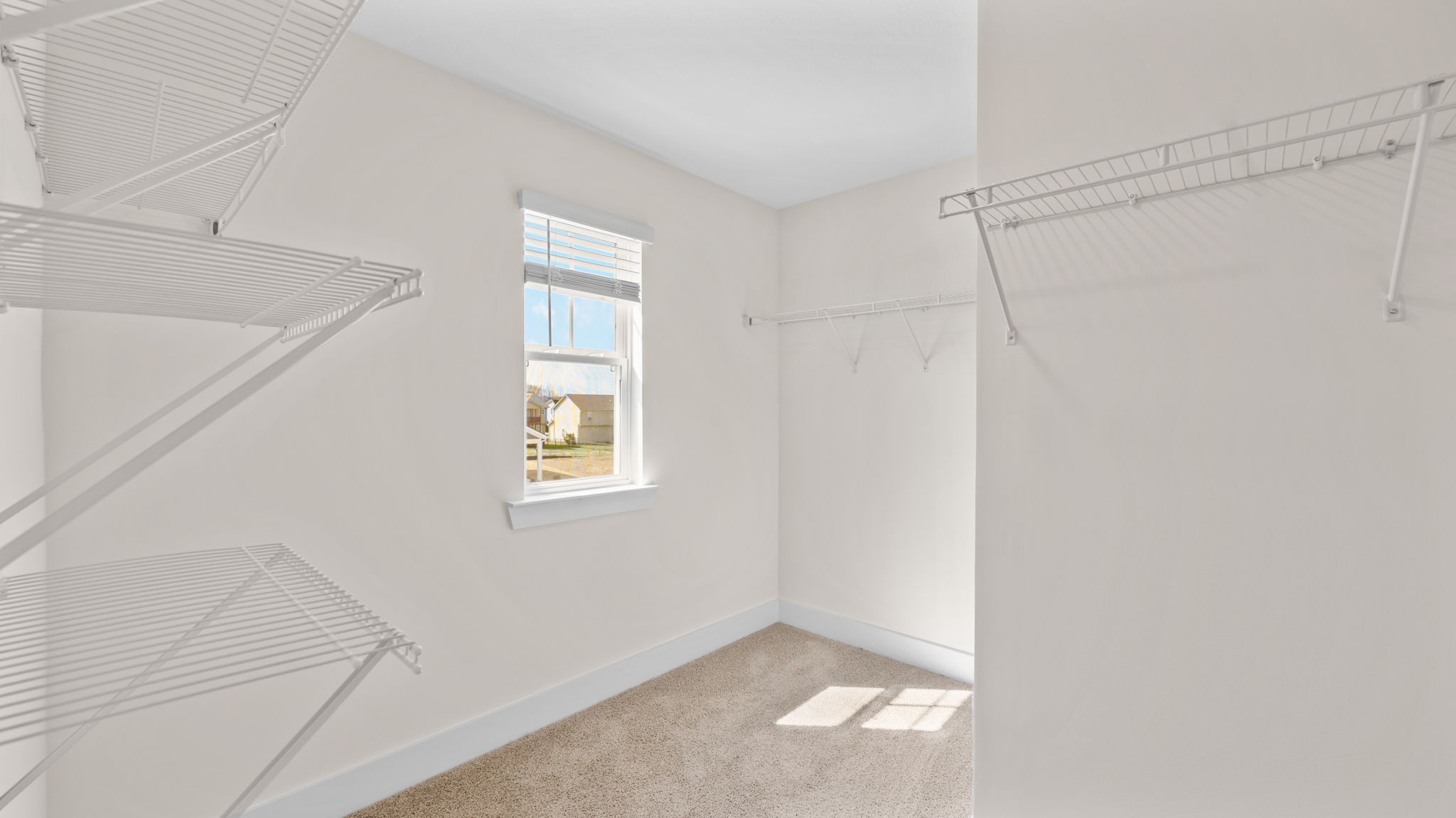 The closet comes with shelving and open space.