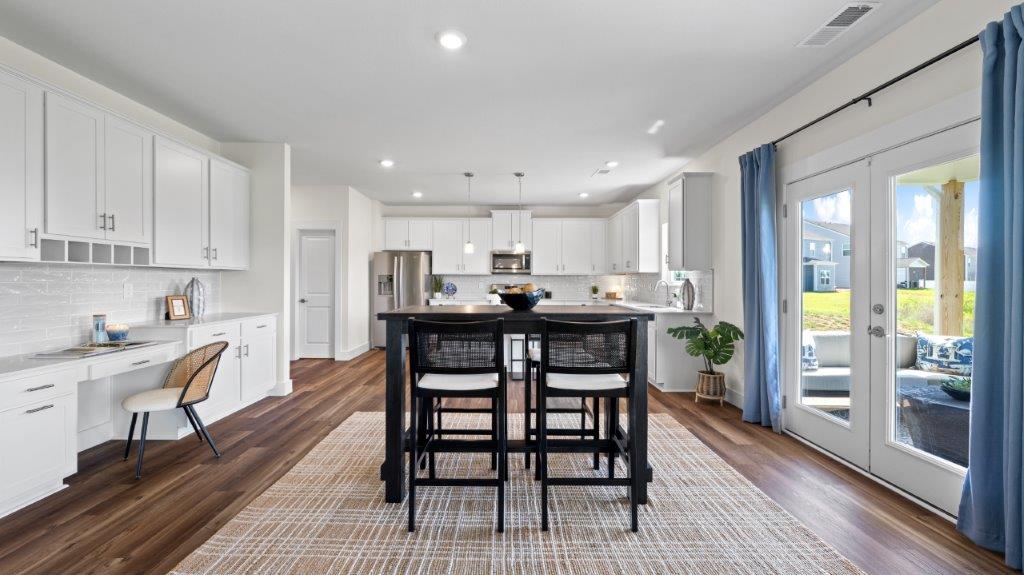 open concept dining with back patio door