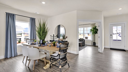 Entrance of home with a formal dining space