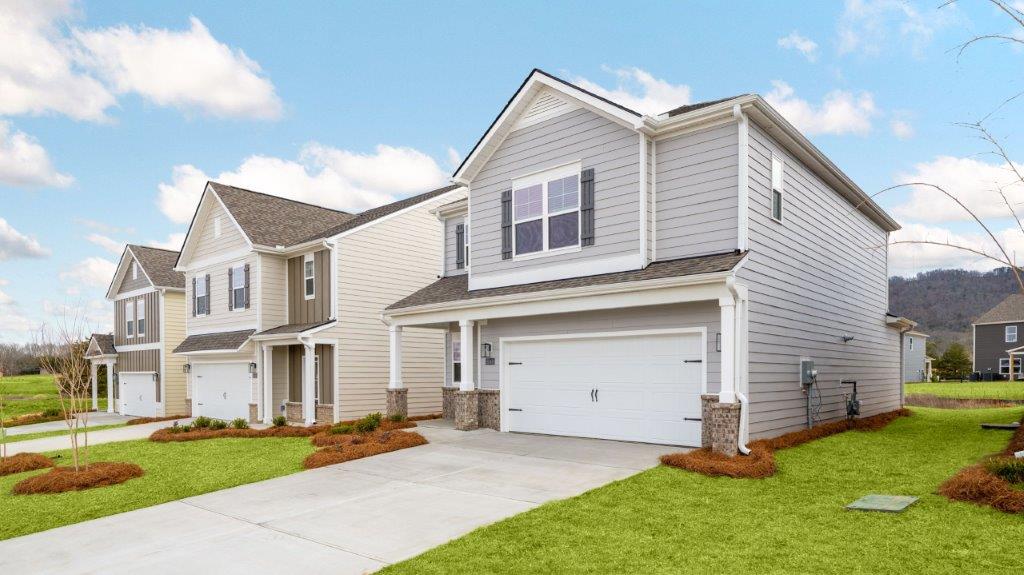 Two story home with two car garage at a front facing angle.
