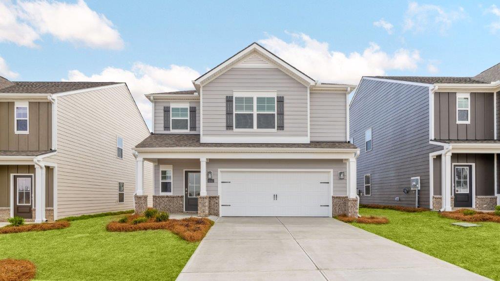 Two story home with two car garage at a front facing angle.