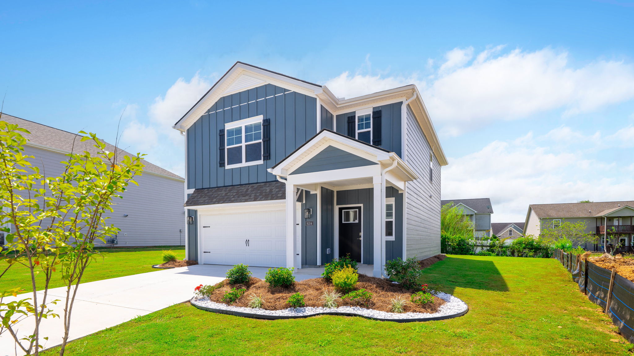 exterior of two story home with board and batten